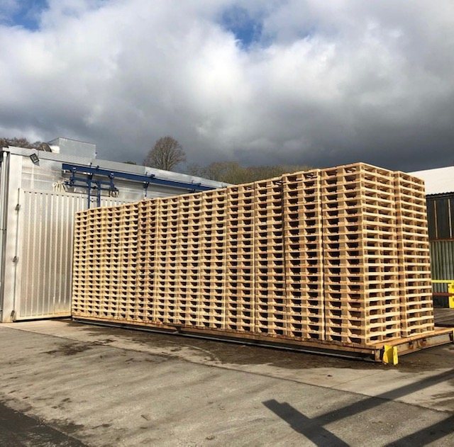 Large stack of new wooden pallets ready for supply